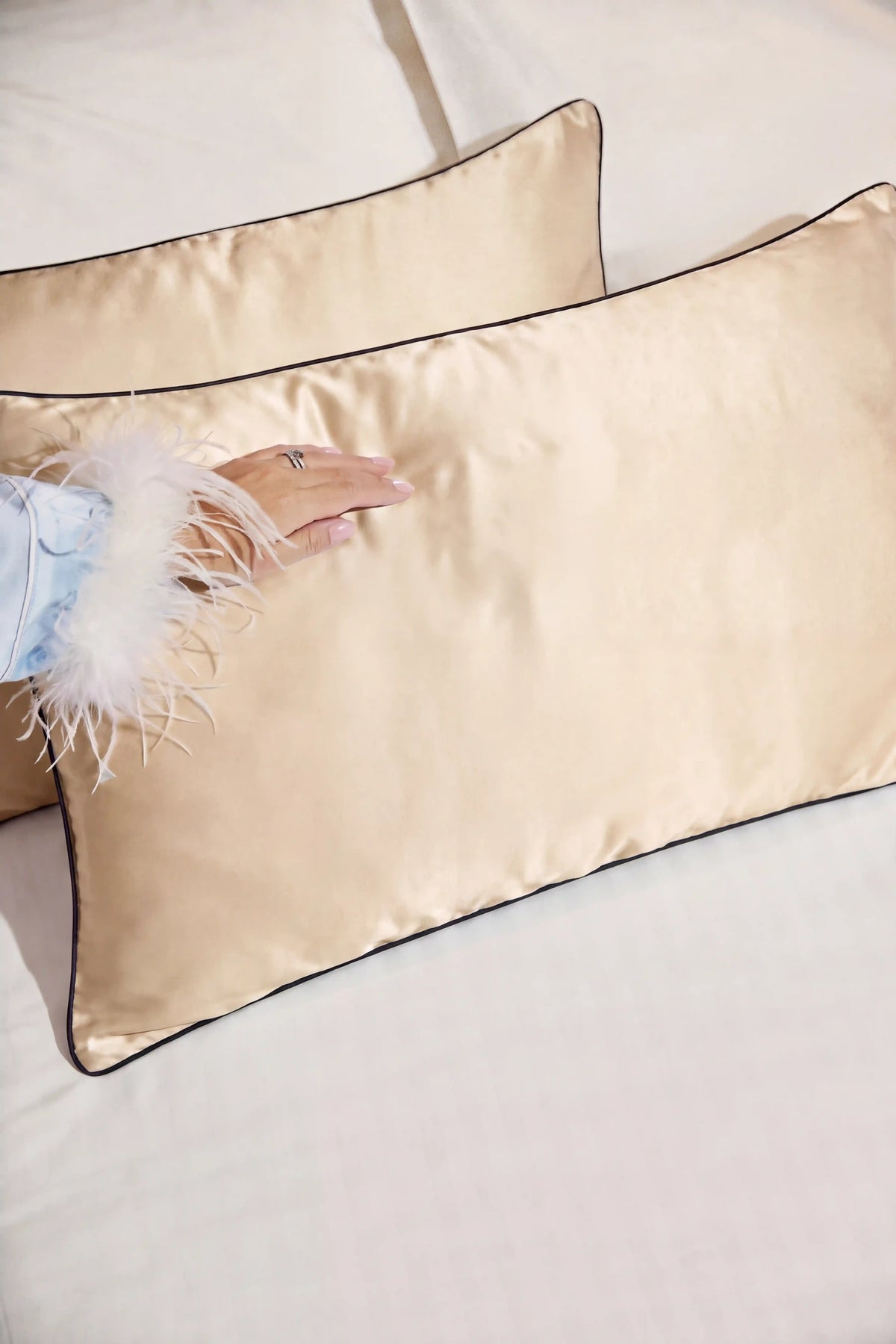 Camille Original Satin Pillowcase in Champagne styled on a bed for an elegant and luxurious bedroom