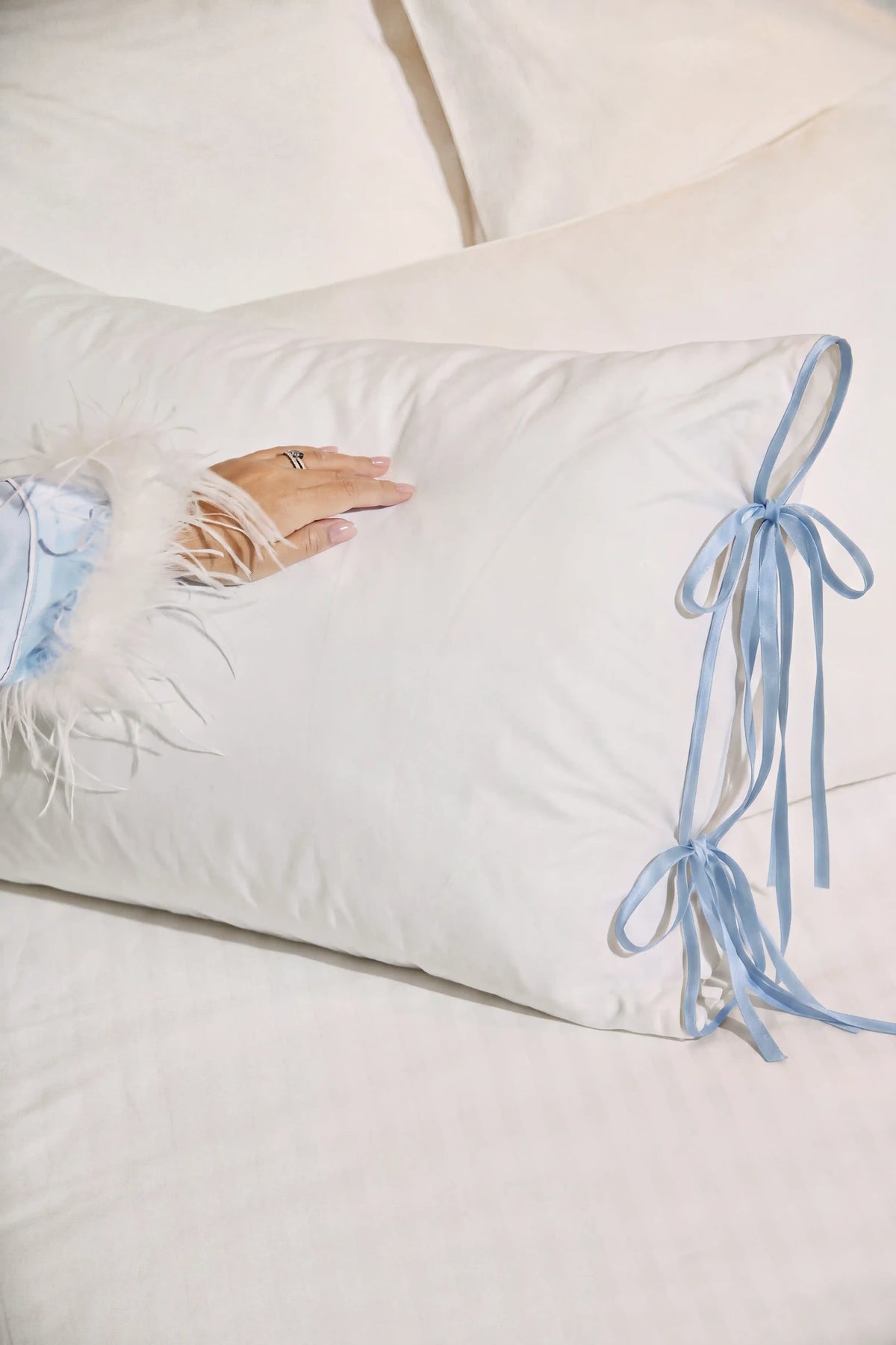 Camille Ribbons Satin Pillowcase in Baby Blue showcasing its silky satin texture and soft blue sheen