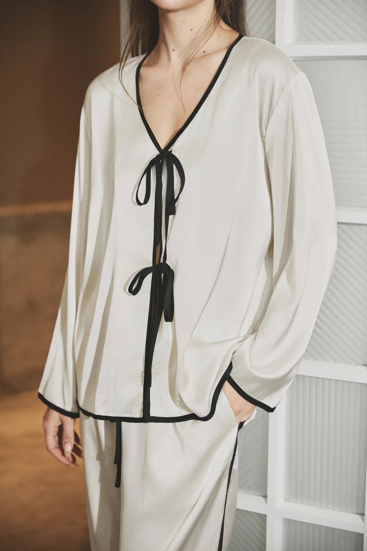 Camille Ribbons Satin Pajama Set in Ivory showcasing the coordinated satin shirt and pajama pants