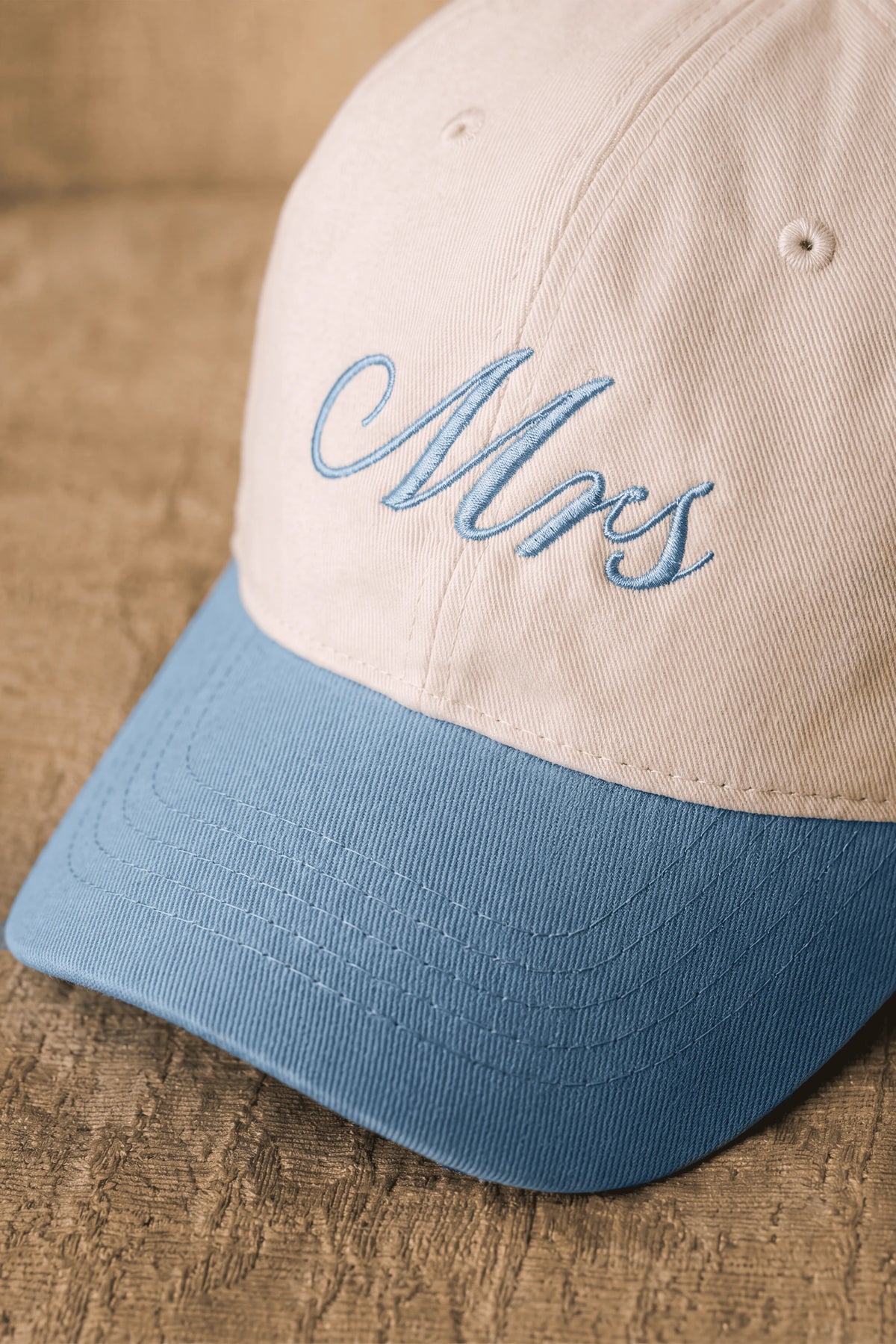 Embroidered Two-Tone Cap in White and Baby Blue featuring detailed embroidery on the front panel
