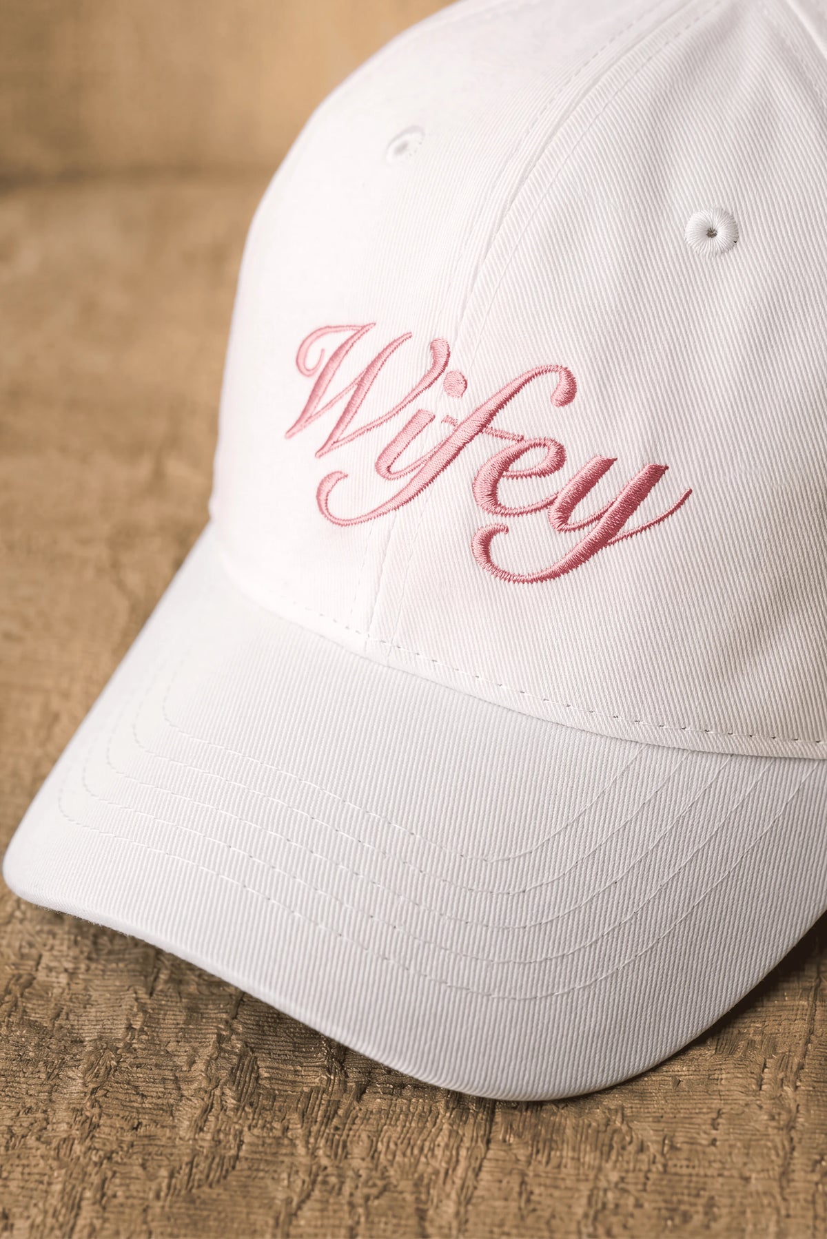 Embroidered White Cap by Meezily featuring detailed stitching on the front panel