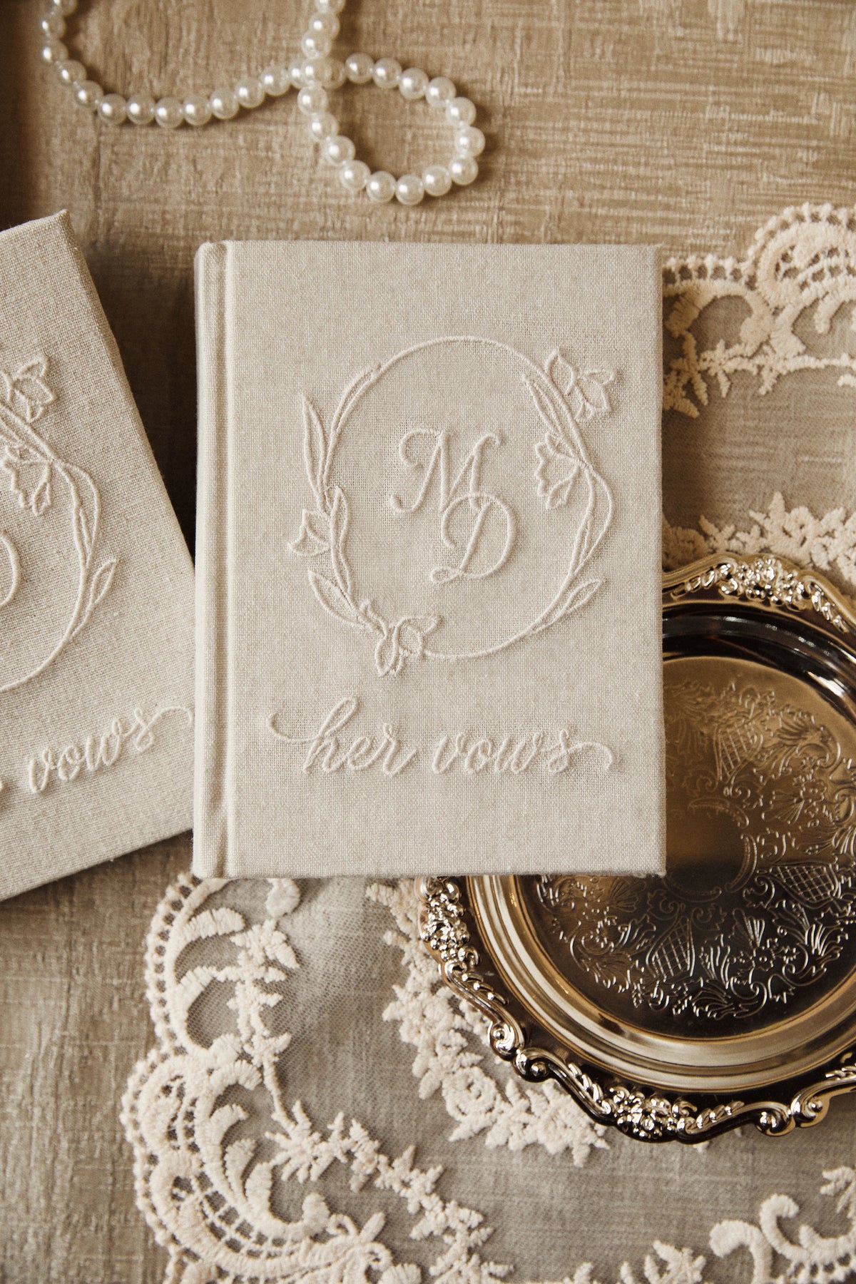 Evermore Embroidered Wedding Vow Book in Ivory showcasing intricate embroidery on the fabric cover