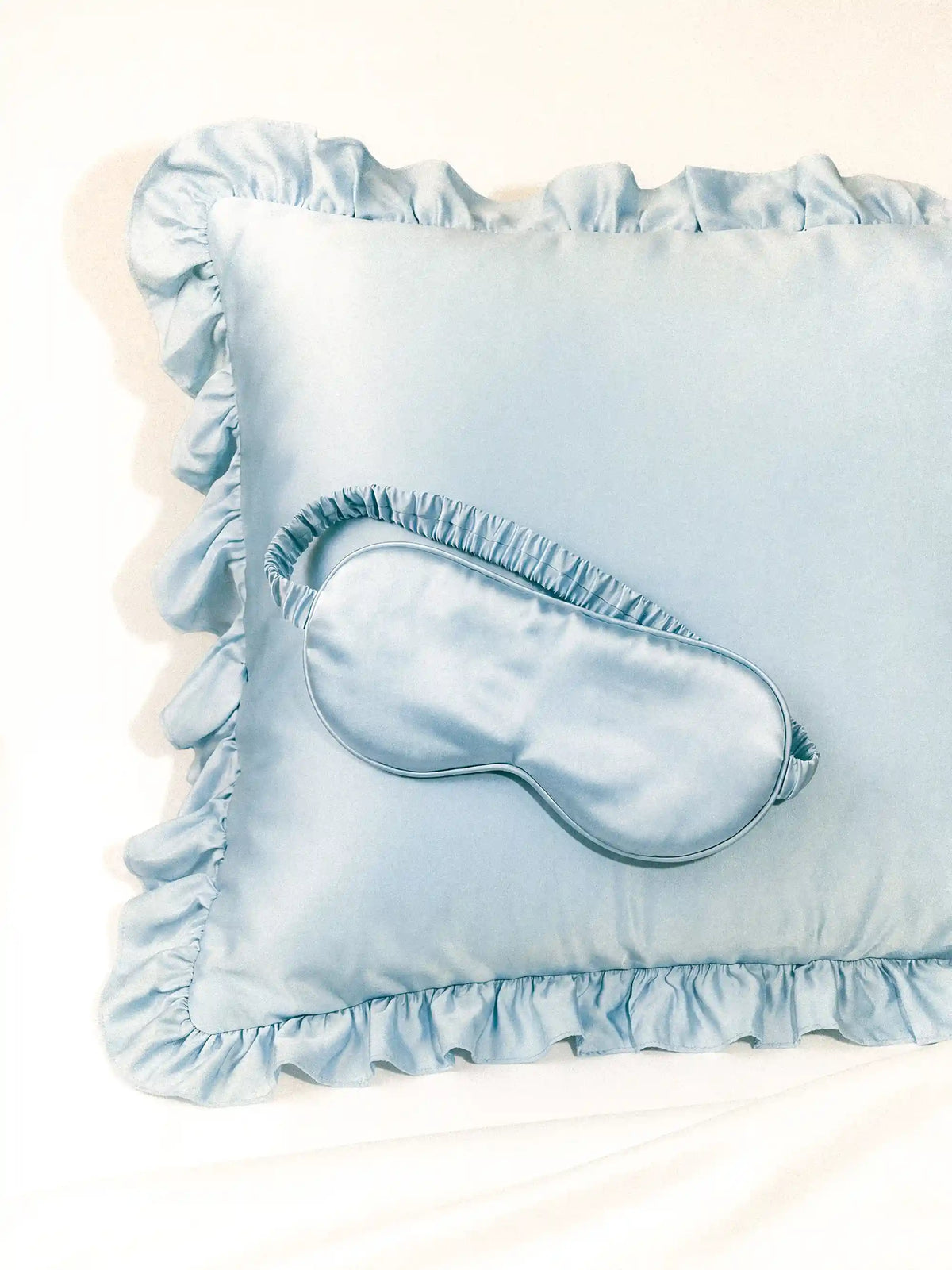 Luxe Satin Sleep Mask in Baby Blue by Meezily, an elegant blue satin eye mask with a smooth finish