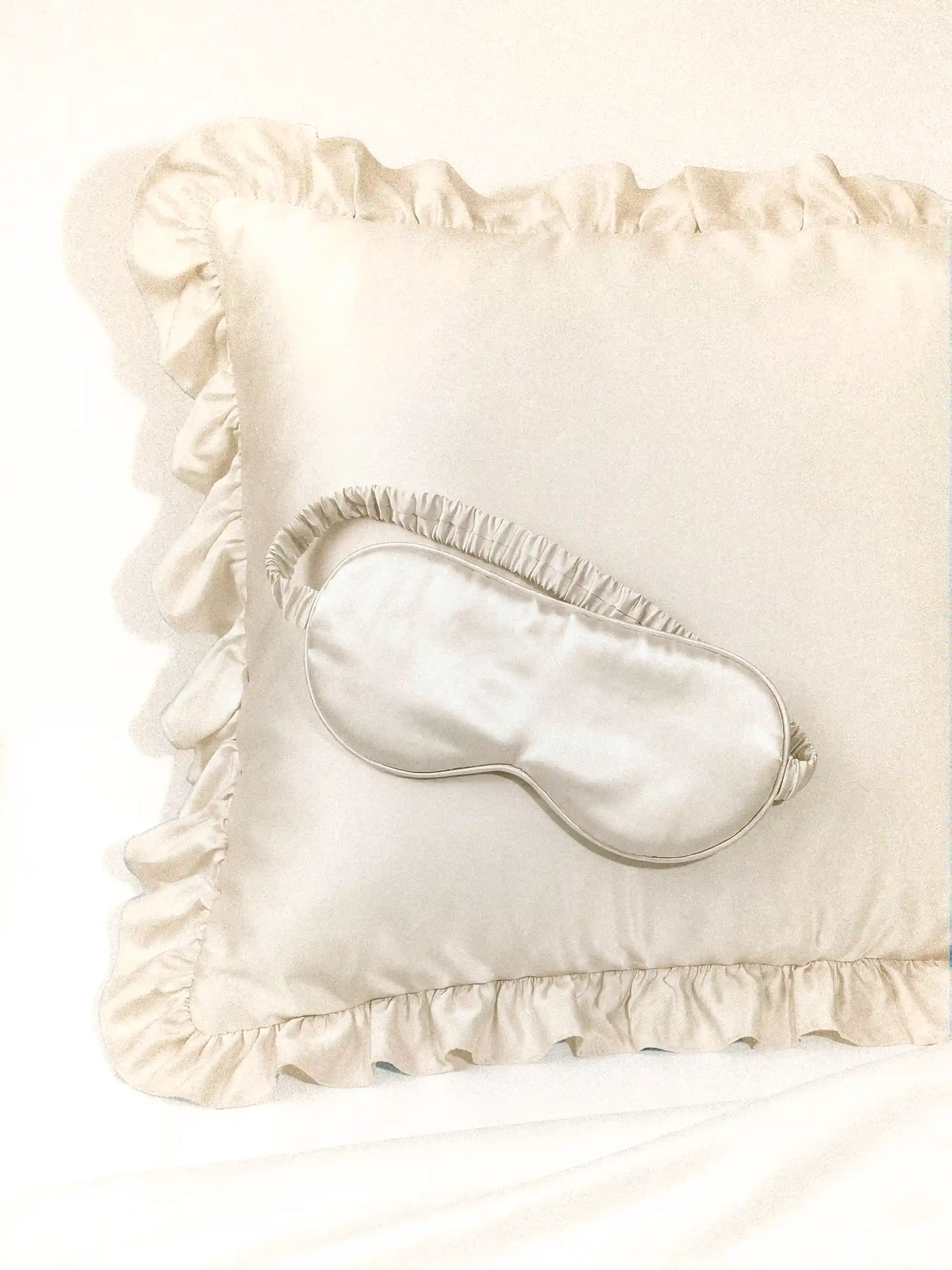 Luxe Satin Sleep Mask in Ivory by Meezily, an elegant ivory satin eye mask designed for a comfortable sleep routine