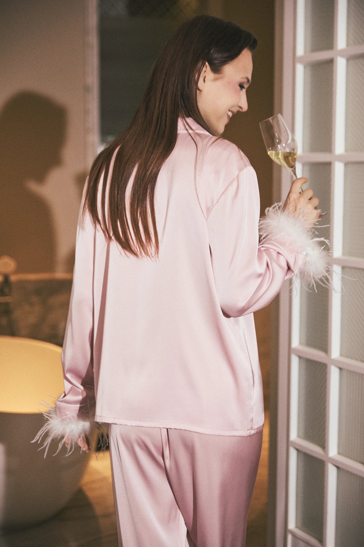 Odette Feather Satin Pajama Set in Baby Pink featuring elegant feather-trimmed cuffs and a smooth satin finish