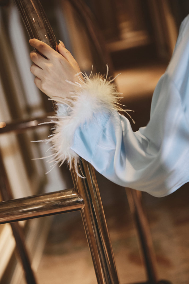 Odette Feather Satin Robe in Baby Blue – back view showcasing the flowing satin silhouette