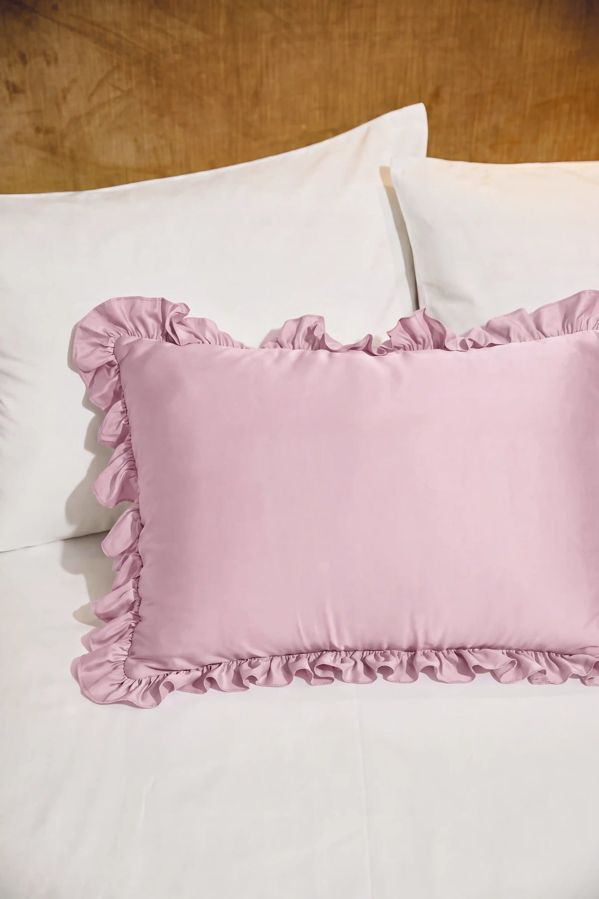 Ruffle Trim Satin Pillowcase in Blush Pink featuring decorative ruffle trim and a smooth satin finish