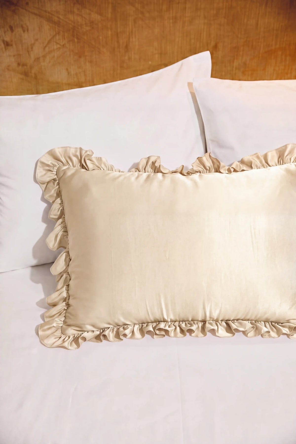 Ruffle Trim Satin Pillowcase in Champagne featuring decorative ruffle trim and a smooth satin finish