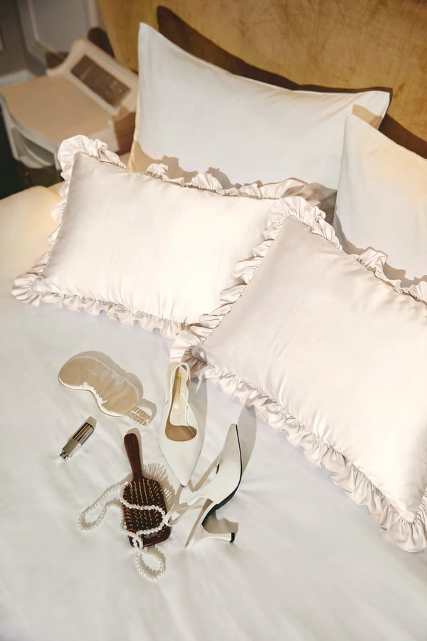 Ruffle Trim Satin Pillowcase in Ivory by Meezily, an elegant ivory satin pillowcase with a delicate ruffled edge